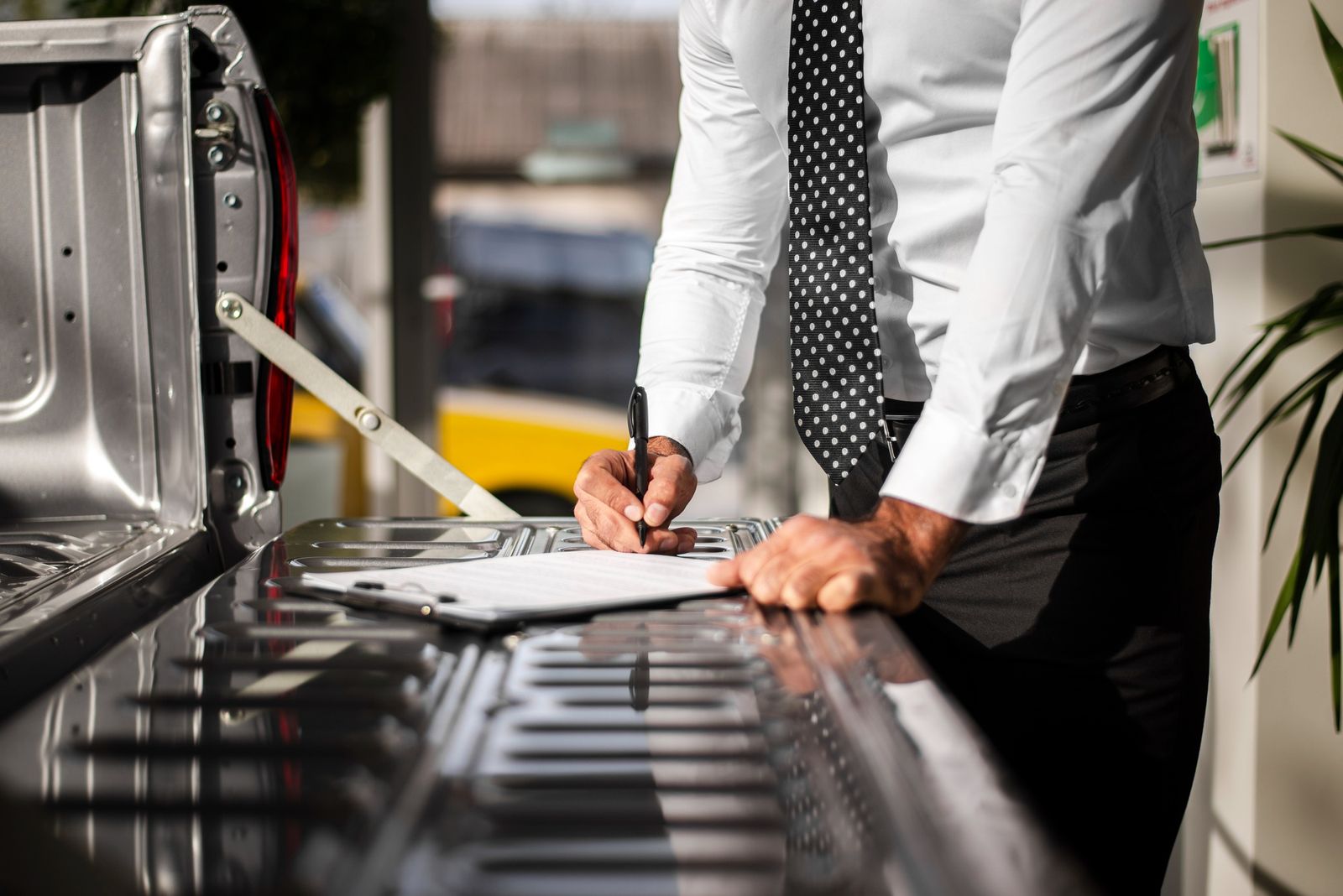 Fleet manager reviewing a maintenance checklist